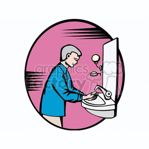 man washing his hand in a sink