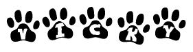 The image shows a row of animal paw prints, each containing a letter. The letters spell out the word Vicky within the paw prints.