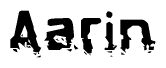 This nametag says Aarin, and has a static looking effect at the bottom of the words. The words are in a stylized font.