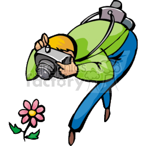 The clipart image depicts a cartoon of a photographer in the act of taking a picture. The photographer is wearing a green jacket and blue pants, with a camera in hand, focusing on a subject. There is also a pink flower with a green stem and leaves depicted near the photographer, which seems to be the subject of the photograph.