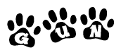 The image shows a series of animal paw prints arranged in a horizontal line. Each paw print contains a letter, and together they spell out the word Gun.