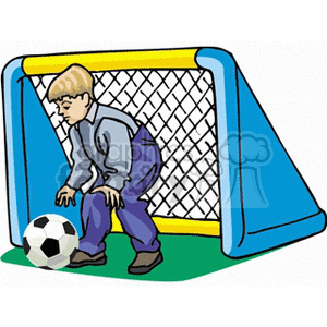 A Young Boy Playing Soccer as the goalkeeper