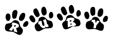 The image shows a row of animal paw prints, each containing a letter. The letters spell out the word Ruby within the paw prints.