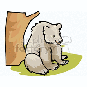 This clipart image features a cartoon of a young brown bear sitting down next to a tree trunk. The bear appears content and is depicted in a simplistic, stylized form typical for clipart. The tree trunk to the left is brown, and the ground is shaded in hues of green, indicating grass or ground cover.