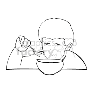 A black and white boy looking into a bowl holding a spoon