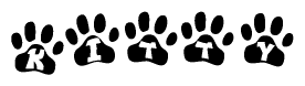 The image shows a series of animal paw prints arranged in a horizontal line. Each paw print contains a letter, and together they spell out the word Kitty.