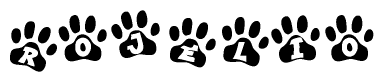 The image shows a row of animal paw prints, each containing a letter. The letters spell out the word Rojelio within the paw prints.