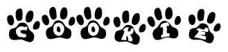 The image shows a series of animal paw prints arranged in a horizontal line. Each paw print contains a letter, and together they spell out the word Cookie.