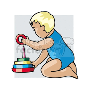 Little baby playing with stacking rubber rings