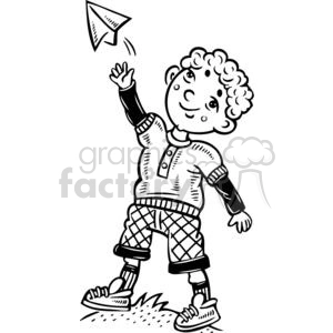 boy playing with a paper airplane