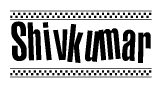 The image contains the text Shivkumar in a bold, stylized font, with a checkered flag pattern bordering the top and bottom of the text.