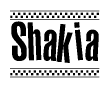 The image contains the text Shakia in a bold, stylized font, with a checkered flag pattern bordering the top and bottom of the text.