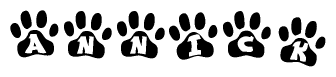 The image shows a series of animal paw prints arranged horizontally. Within each paw print, there's a letter; together they spell Annick