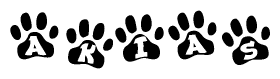 The image shows a series of animal paw prints arranged in a horizontal line. Each paw print contains a letter, and together they spell out the word Akias.