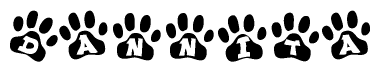 The image shows a row of animal paw prints, each containing a letter. The letters spell out the word Dannita within the paw prints.