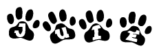The image shows a series of animal paw prints arranged in a horizontal line. Each paw print contains a letter, and together they spell out the word Juie.