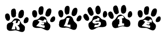 The image shows a series of animal paw prints arranged in a horizontal line. Each paw print contains a letter, and together they spell out the word Kelsie.