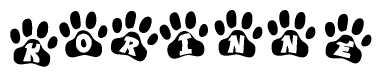The image shows a row of animal paw prints, each containing a letter. The letters spell out the word Korinne within the paw prints.