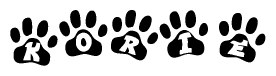 The image shows a series of animal paw prints arranged horizontally. Within each paw print, there's a letter; together they spell Korie