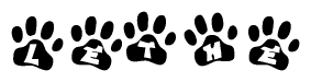 The image shows a series of animal paw prints arranged in a horizontal line. Each paw print contains a letter, and together they spell out the word Lethe.