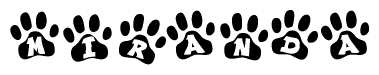 The image shows a series of animal paw prints arranged in a horizontal line. Each paw print contains a letter, and together they spell out the word Miranda.