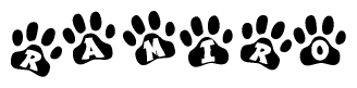 The image shows a series of animal paw prints arranged in a horizontal line. Each paw print contains a letter, and together they spell out the word Ramiro.