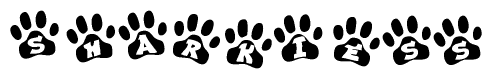 The image shows a series of animal paw prints arranged in a horizontal line. Each paw print contains a letter, and together they spell out the word Sharkiess.
