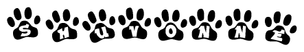 The image shows a row of animal paw prints, each containing a letter. The letters spell out the word Shuvonne within the paw prints.