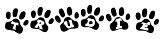 The image shows a series of animal paw prints arranged horizontally. Within each paw print, there's a letter; together they spell Trudie