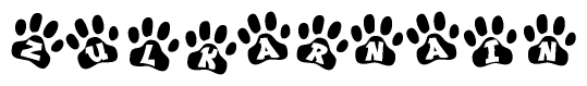 The image shows a series of animal paw prints arranged in a horizontal line. Each paw print contains a letter, and together they spell out the word Zulkarnain.