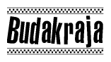 The clipart image displays the text Budakraja in a bold, stylized font. It is enclosed in a rectangular border with a checkerboard pattern running below and above the text, similar to a finish line in racing. 
