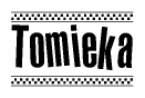 The clipart image displays the text Tomieka in a bold, stylized font. It is enclosed in a rectangular border with a checkerboard pattern running below and above the text, similar to a finish line in racing. 