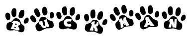 The image shows a row of animal paw prints, each containing a letter. The letters spell out the word Buckman within the paw prints.
