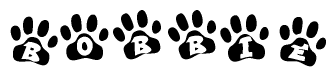 The image shows a series of animal paw prints arranged in a horizontal line. Each paw print contains a letter, and together they spell out the word Bobbie.