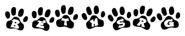 The image shows a series of animal paw prints arranged in a horizontal line. Each paw print contains a letter, and together they spell out the word Bethsrg.