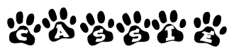 The image shows a row of animal paw prints, each containing a letter. The letters spell out the word Cassie within the paw prints.
