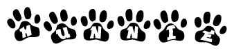 The image shows a row of animal paw prints, each containing a letter. The letters spell out the word Hunnie within the paw prints.