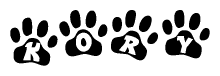The image shows a series of animal paw prints arranged horizontally. Within each paw print, there's a letter; together they spell Kory