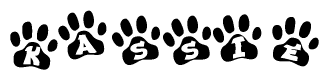 The image shows a series of animal paw prints arranged horizontally. Within each paw print, there's a letter; together they spell Kassie