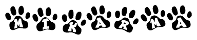 The image shows a series of animal paw prints arranged in a horizontal line. Each paw print contains a letter, and together they spell out the word Mikarma.