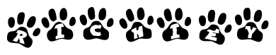 The image shows a series of animal paw prints arranged horizontally. Within each paw print, there's a letter; together they spell Richiey