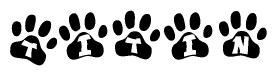 The image shows a series of animal paw prints arranged in a horizontal line. Each paw print contains a letter, and together they spell out the word Titin.
