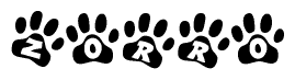 The image shows a row of animal paw prints, each containing a letter. The letters spell out the word Zorro within the paw prints.