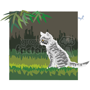 Gray tabby cat sitting in green grass