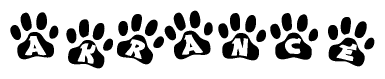 The image shows a series of animal paw prints arranged in a horizontal line. Each paw print contains a letter, and together they spell out the word Akrance.