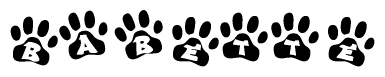 The image shows a row of animal paw prints, each containing a letter. The letters spell out the word Babette within the paw prints.
