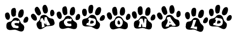 The image shows a series of animal paw prints arranged in a horizontal line. Each paw print contains a letter, and together they spell out the word Cmcdonald.