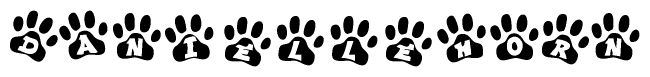 The image shows a row of animal paw prints, each containing a letter. The letters spell out the word Daniellehorn within the paw prints.