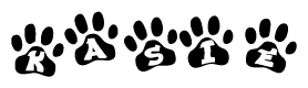 The image shows a series of animal paw prints arranged in a horizontal line. Each paw print contains a letter, and together they spell out the word Kasie.