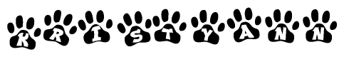 The image shows a row of animal paw prints, each containing a letter. The letters spell out the word Kristyann within the paw prints.